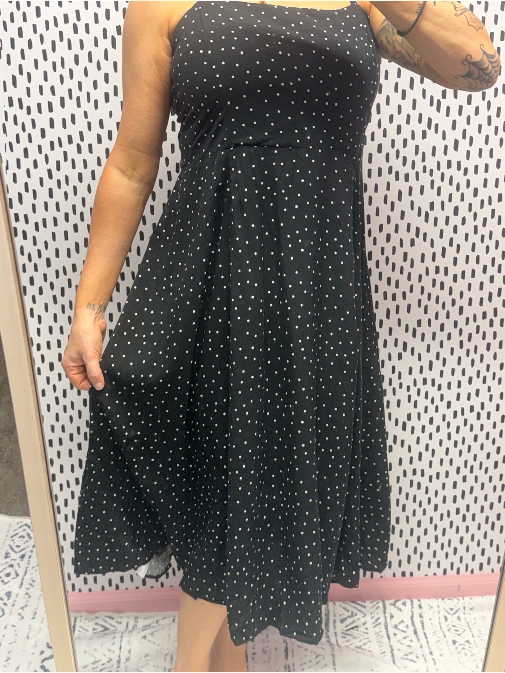 Black spaghetti strapped sundress from GAP features a playful white polka dot